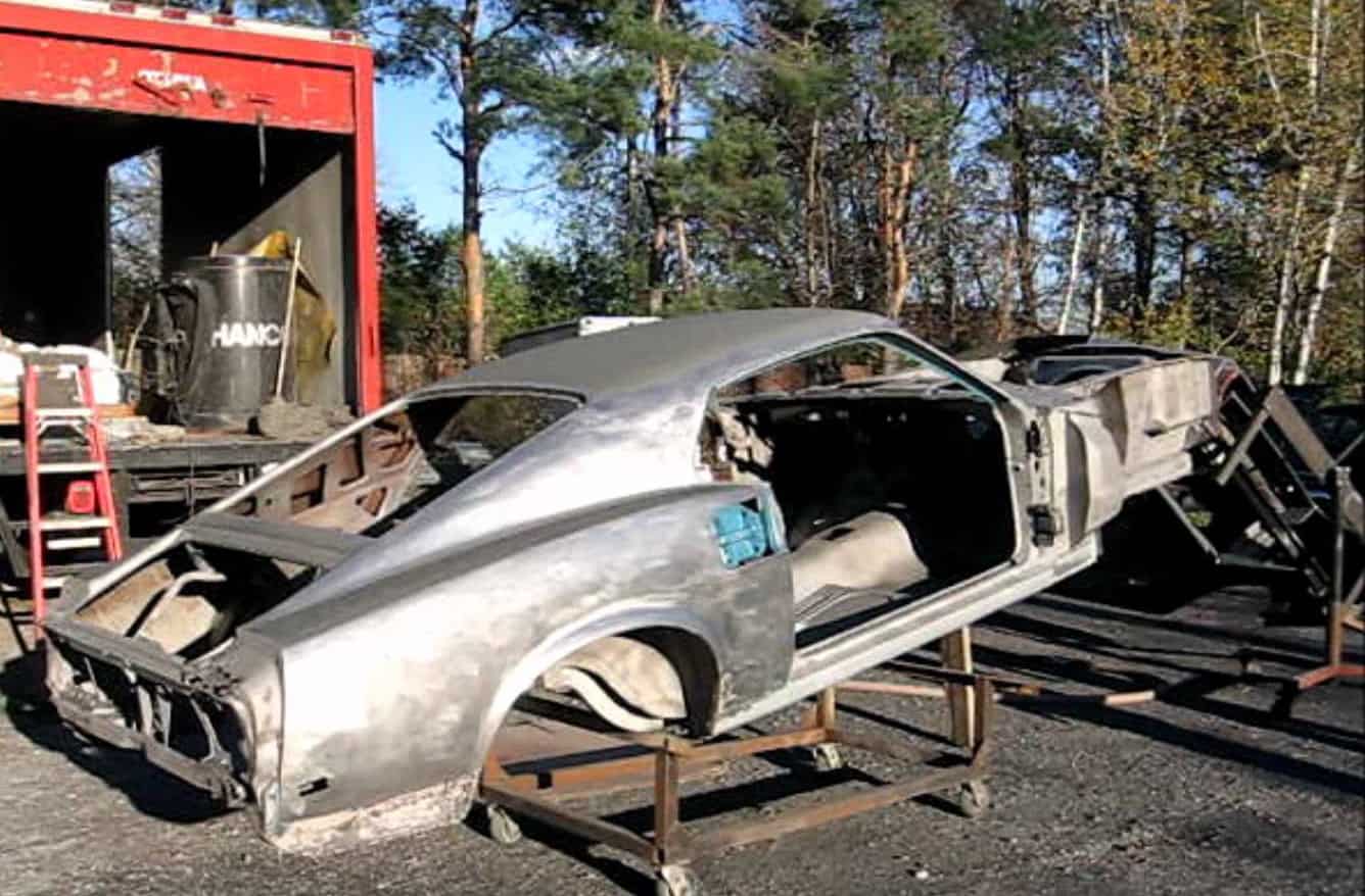car shell hoisted and about to be prepped by mobile sandless blasting - Blast From the Past